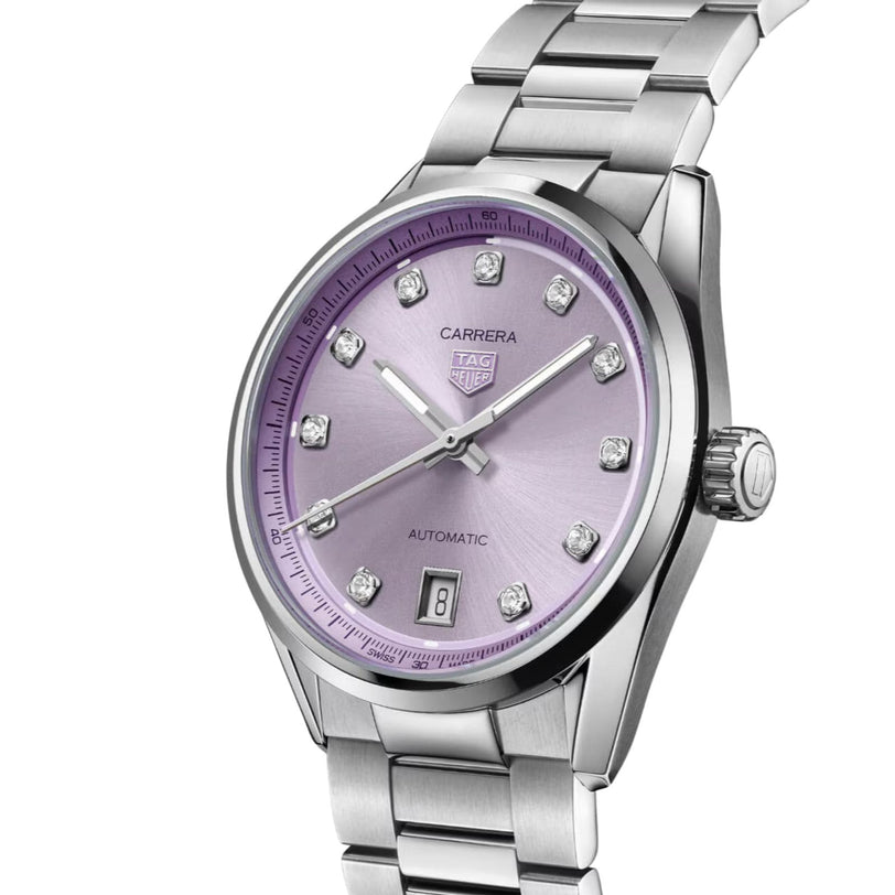 Silver TAG Heuer Carrera Date watch with a light purple dial, diamond hour markers, and a metal bracelet.