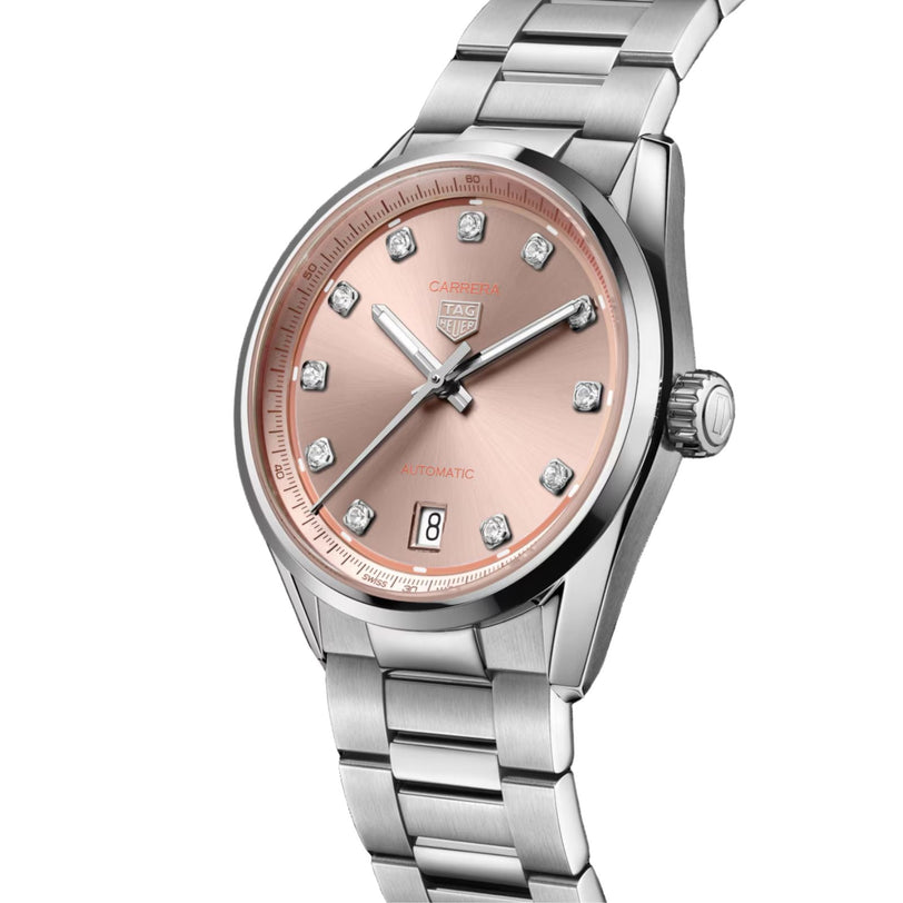 A TAG Heuer Carrera Date watch featuring a pink dial, diamond hour markers, silver-tone case, and metal bracelet.