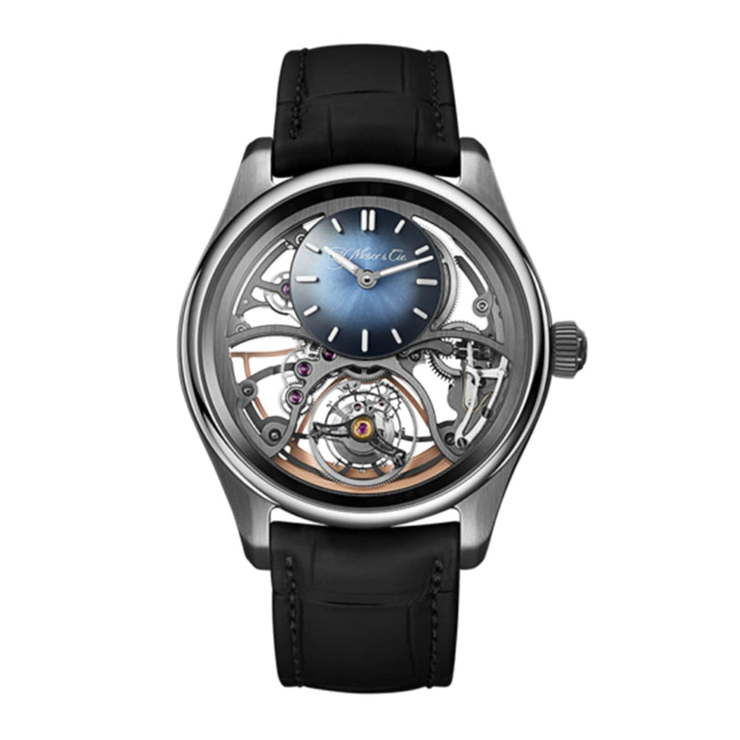The H. Moser & Cie Pioneer Cylindrical Tourbillon Skeleton is a mechanical wristwatch with a blue gradient dial, visible tourbillon movement, silver case, and black leather strap.