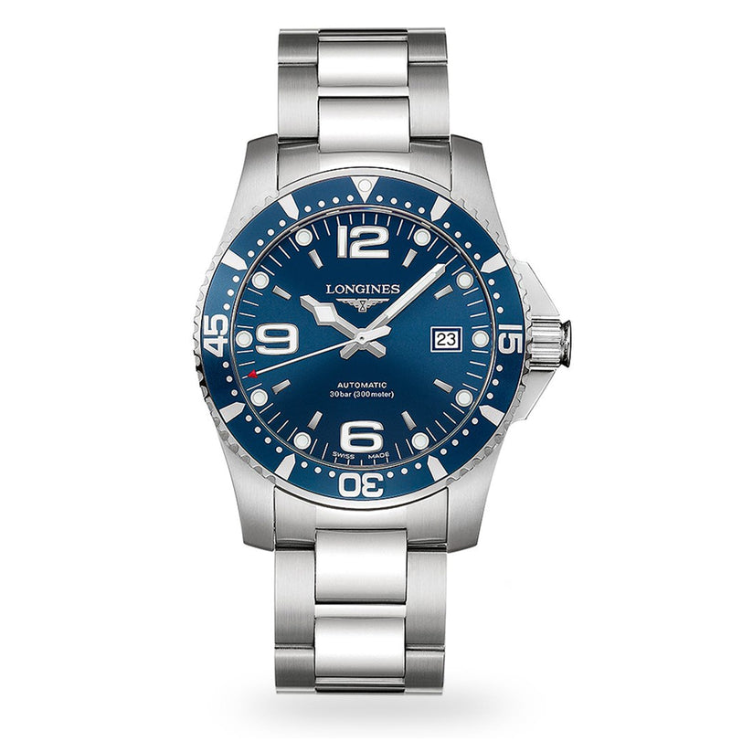 The Longines HydroConquest is a stainless steel diving watch with a blue dial, white markers, date display at 3 o’clock, and a water-resistant metal link bracelet.