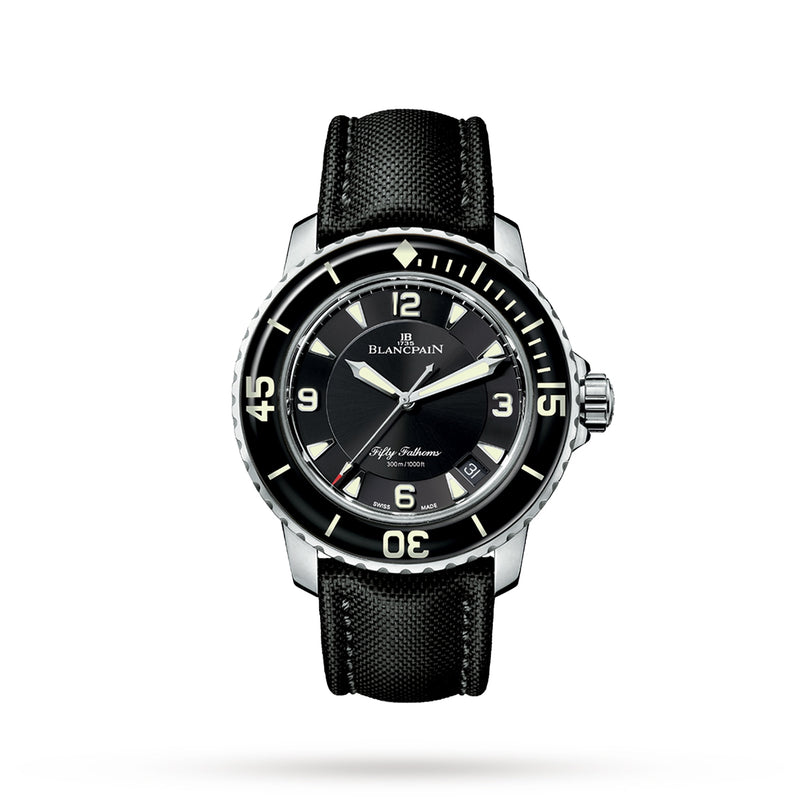 A Blancpain Fifty Fathoms Automatique diver’s watch with a 45mm steel case, black dial, bold white numerals, and a black textured strap is displayed on a white background.
