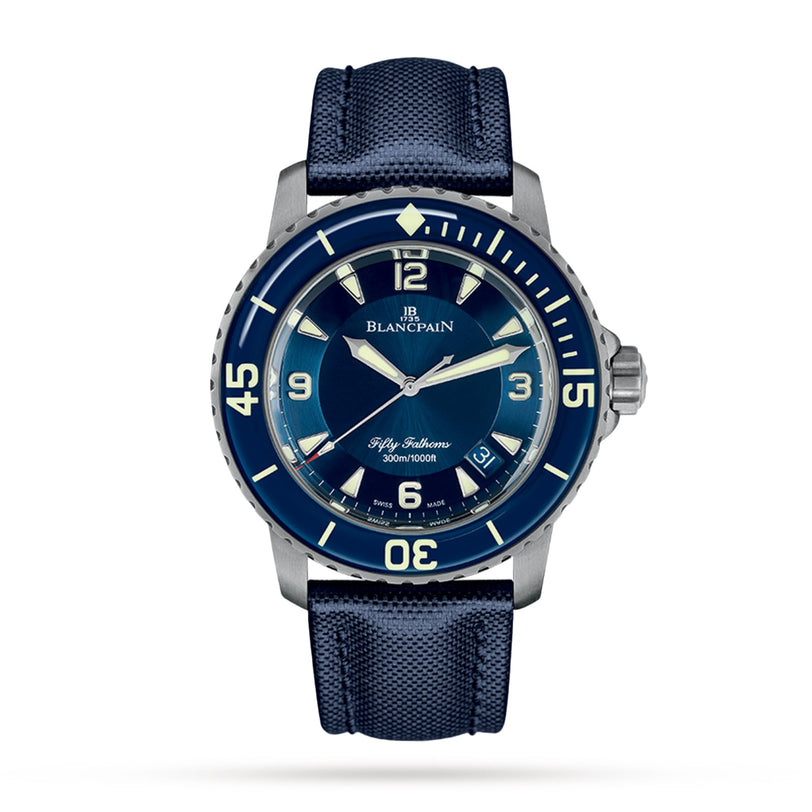 The Blancpain Fifty Fathoms Automatique features a blue dial with large white numerals and a textured blue strap, shown against a plain white background.