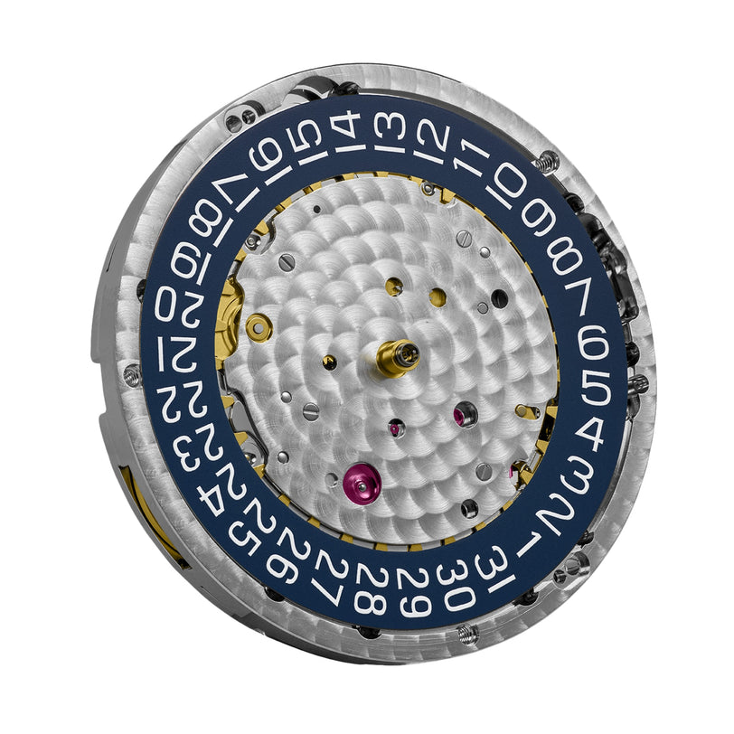 Close-up of the Blancpain Fifty Fathoms Automatique watch movement, showcasing its metallic finish, decorative patterns, and 1315 automatic movement with a circular date ring numbered 1 to 31.