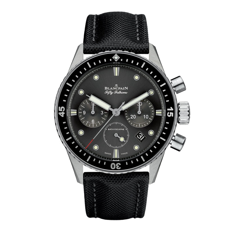 The Blancpain Fifty Fathoms Bathyscaphe Chronographe Flyback features a black dial with three subdials, date display, black bezel, and black fabric strap—a legendary diver’s watch crafted for underwater adventure.