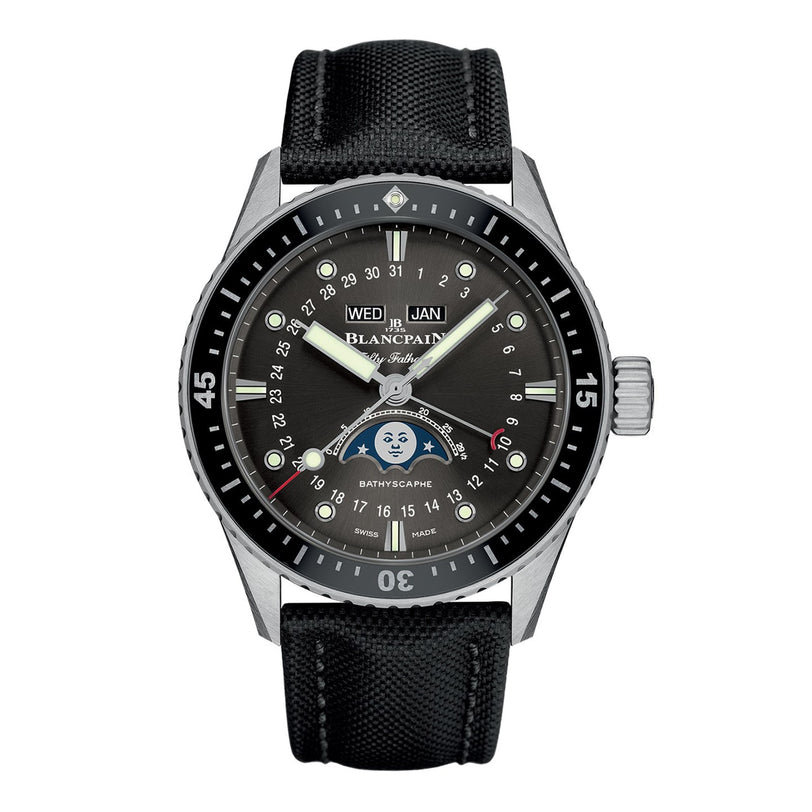 The Blancpain Fifty Fathoms Bathyscaphe Quantième Complet Phases de Lune features a black dial and bezel, date, weekday, month and moon phase indicators, plus a sophisticated black fabric strap—embracing Blancpains luxury tradition.
