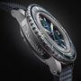 Close-up view of the Blancpain Fifty Fathoms Automatique wristwatch featuring a blue dial, bold markers, and a textured dark strap.