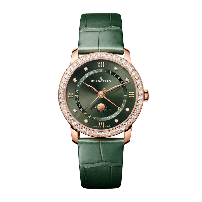 The Blancpain Villeret Quantième Phases de Lune is a luxury wristwatch featuring a green leather strap, diamond bezel, gold case, green dial with Roman numerals, moonphase display, and the Blancpain name on the face.