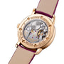 The back of the Vacheron Constantin Traditionnelle Manual-winding reveals its mechanical movement in an 18K pink gold case with fine engravings and a beige leather strap accented by striking purple edges.