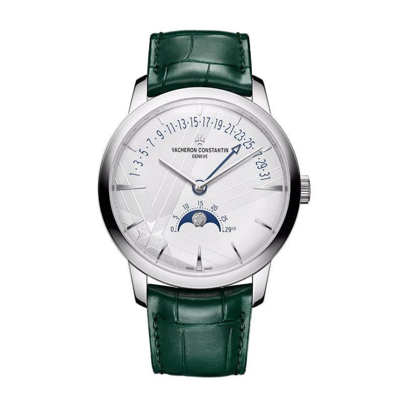 The Vacheron Constantin Patrimony Moon Phase Retrograde Date is a limited edition watch in 18K white gold with a green leather strap, displaying moon phase, retrograde date, and power reserve on a refined white dial.