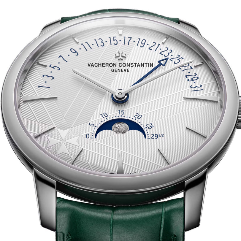The Vacheron Constantin Patrimony Moon Phase Retrograde Date is an 18K white gold watch with a green strap, blue date hand, and a moon phase subdial at 6 o’clock—ideal for collectors seeking limited edition pieces.