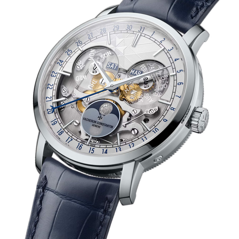 Close-up of the Vacheron Constantin Traditionnelle Complete Calendar Openface, a limited edition platinum watch featuring a skeleton dial with full calendar—days, months, moon phase—and a blue leather strap.
