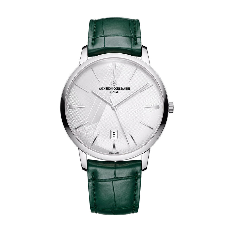 The Vacheron Constantin Patrimony Self-Winding limited edition wristwatch in 18K white gold features a white patterned dial, date window, and green leather strap, shown on a white background.