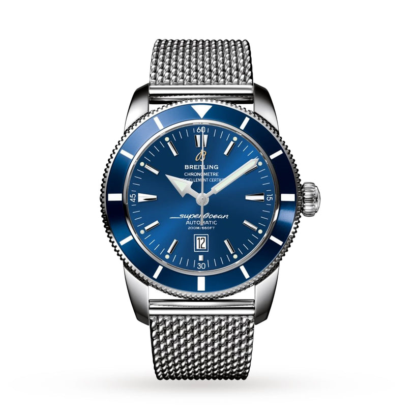 The Breitling Superocean Heritage B20 Automatic 46 features a blue dial, date at 6 o’clock, stainless steel case, water resistance, and silver mesh bracelet. Shown on a white background.