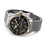 The Breitling Superocean Heritage B20 Automatic 44 features a black dial, gold accents, date display, and a water-resistant stainless steel bracelet, shown against a white background.