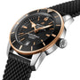 The Breitling Superocean Heritage B20 Automatic 42 features a black dial, gold bezel, date window, and black textured strap. Shown at an angle, it runs on the Breitling B20 movement and is designed for water resistance.