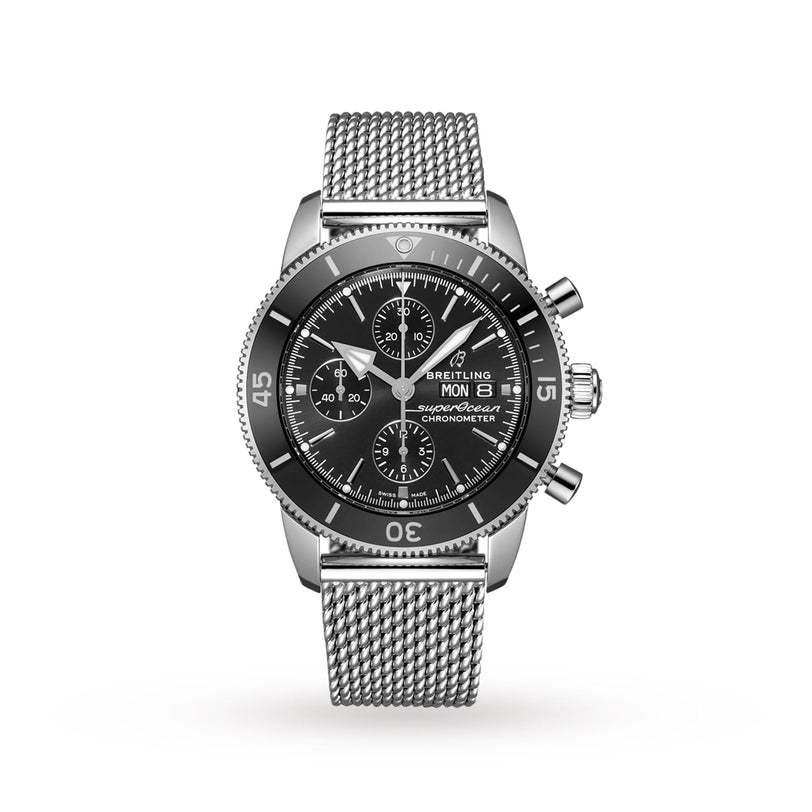 A Breitling Superocean Heritage Chronograph 44 stainless steel watch with a black dial, mesh bracelet, chronograph features, and rotating bezel powered by the Breitling 13 calibre, shown on a white background.
