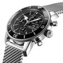 Close-up of the Breitling Superocean Heritage Chronograph 44, showcasing its stainless steel case, black dial with three subdials, date display, and a matching stainless steel mesh strap.