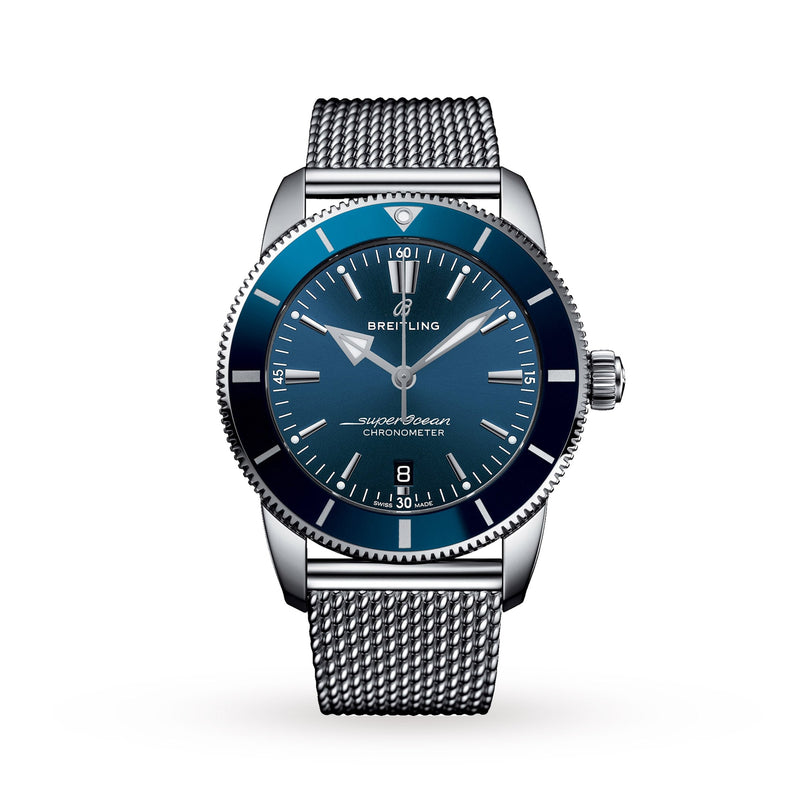 The Breitling Superocean Heritage B20 Automatic 44 features a blue dial, silver hour markers, and a stainless steel mesh bracelet, set in a robust stainless steel case against a white background.