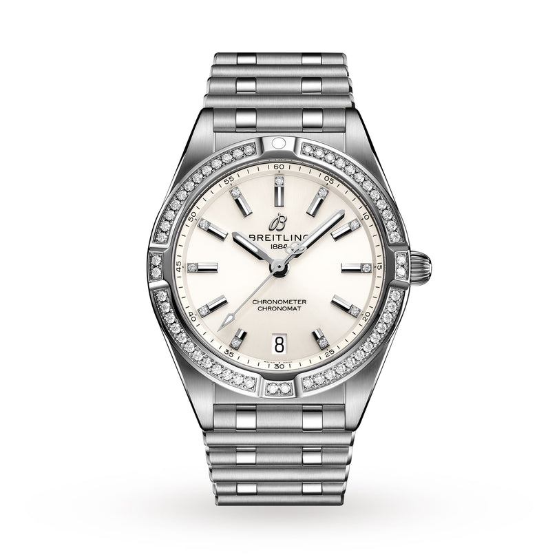 Breitling Chronomat 32: A silver wristwatch with a white dial, diamond-set bezel, Rouleaux bracelet, date at 6 o’clock, and SuperQuartz™ chronometer movement.