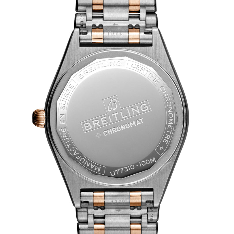 Back view of the Breitling Chronomat 32 watch featuring engraved branding, COSC-certified chronometer details, and a two-tone metal bracelet.