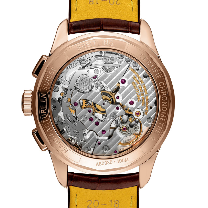 Close-up of the Breitling Premier B09 Chronograph 40, highlighting its intricate mechanical movement and engraved details on the 40mm 18K red gold chronometer-certified case.