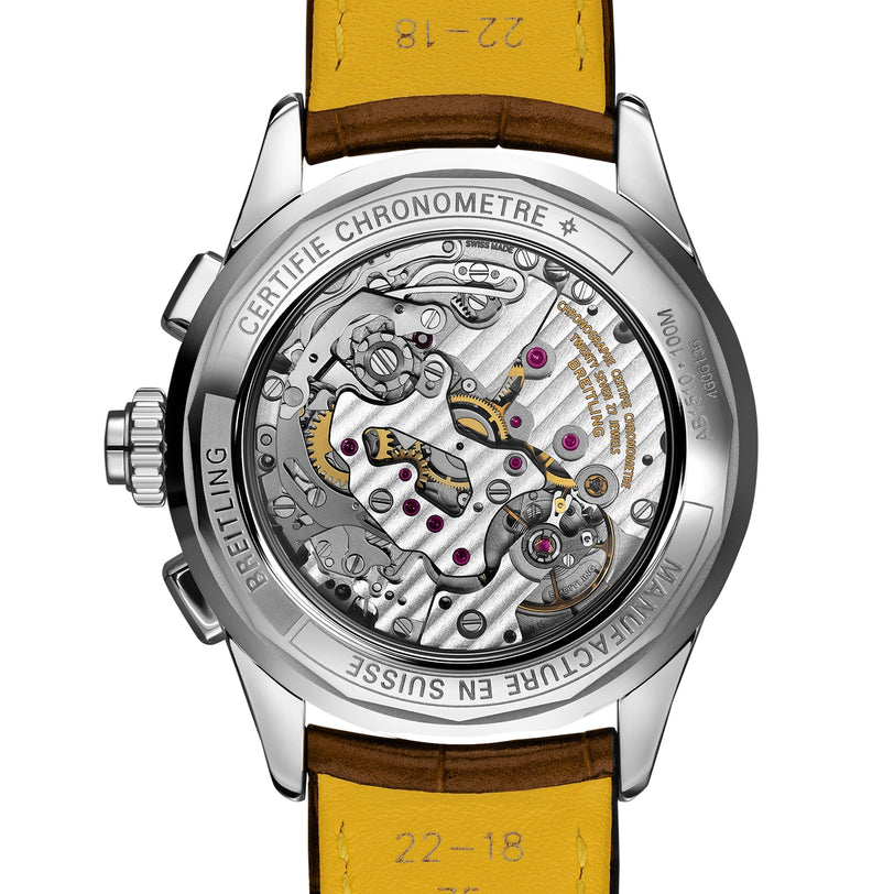 Back view of the Breitling Premier B15 Duograph 42, featuring a transparent case revealing its intricate COSC-certified movement, visible gears, and a brown leather strap with yellow lining.