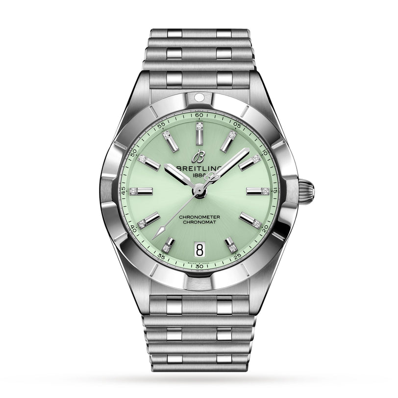 The Breitling Chronomat 32 wristwatch features a mint green dial, silver hour markers, date window at 6 o’clock, and a Rouleaux bracelet, with SuperQuartz™ chronometer precision—all shown on a white background.