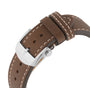 Close-up of a brown leather strap with white stitching and a stainless steel buckle engraved with the Breitling logo, designed for the Super AVI B04 Chronograph GMT 46 Mosquito—a tribute to aviation heritage.