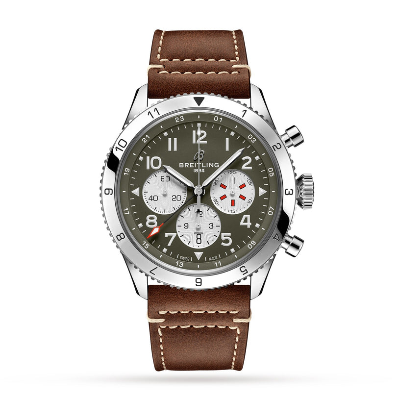 The Breitling Super AVI B04 Chronograph GMT 46 Curtiss Warhawk features a green dial with white subdials, a silver bezel, and brown leather strap, inspired by aviation heritage, displayed on a white background.