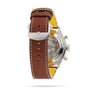 A close-up of the Breitling Super AVI B04 Chronograph GMT 46 Curtiss Warhawk showcases its back case, visible movement, and brown leather strap with a silver buckle—emphasizing its aviation heritage.