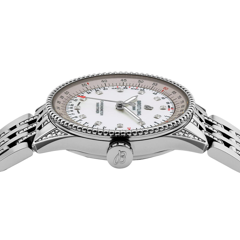 The Breitling Navitimer 32 wristwatch features a silver case, white dial, diamond hour markers, and a metal bracelet, displayed in a side view.