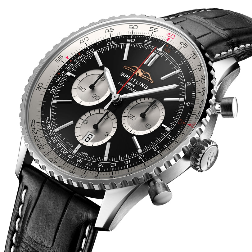 Close-up of a Breitling Navitimer B01 Chronograph 46 wristwatch featuring a black dial, three subdials, date window, and a black leather strap with white stitching.