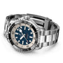 The Breitling Superocean Automatic 44 is a stainless steel dive watch featuring a black and white bezel, blue dial, bold white hour markers, and automatic Breitling 17 calibre movement on a metal bracelet.