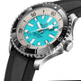 Close-up of the Breitling Superocean Automatic 44 dive watch with a turquoise dial, black bezel, stainless steel case, and black textured rubber strap.