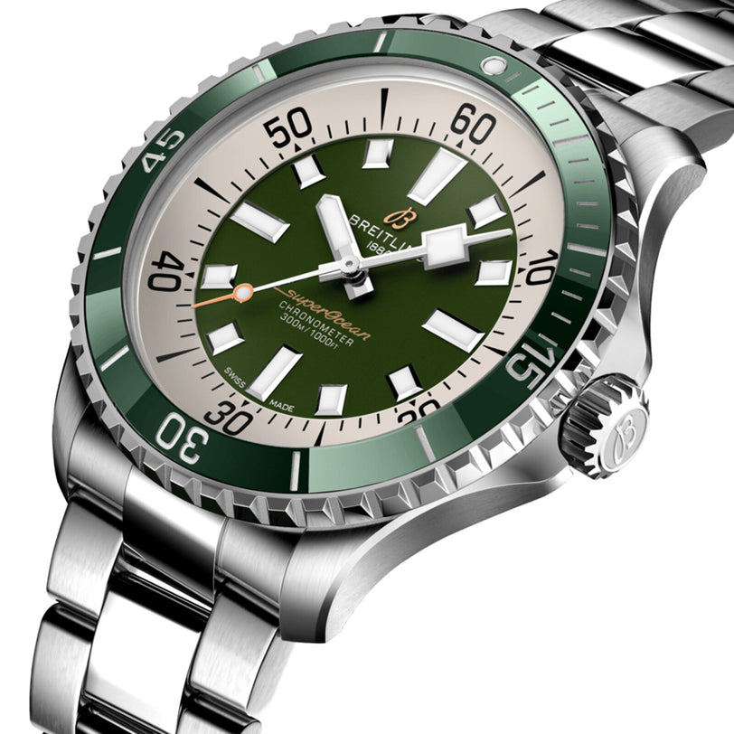 The Breitling Superocean Automatic 44 is a stainless steel dive watch with a green dial and bezel, white hour markers, metal link band, and automatic movement.