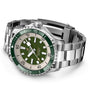 The Breitling Superocean Automatic 44, a stainless steel dive watch with a green bezel, green dial, white hour markers, and metal bracelet, is shown at an angle on a white background.