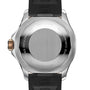 The back of a Breitling Superocean Automatic 42 dive watch features a metal case, black rubber strap, and engraved text denoting Swiss manufacture and 300M water resistance.