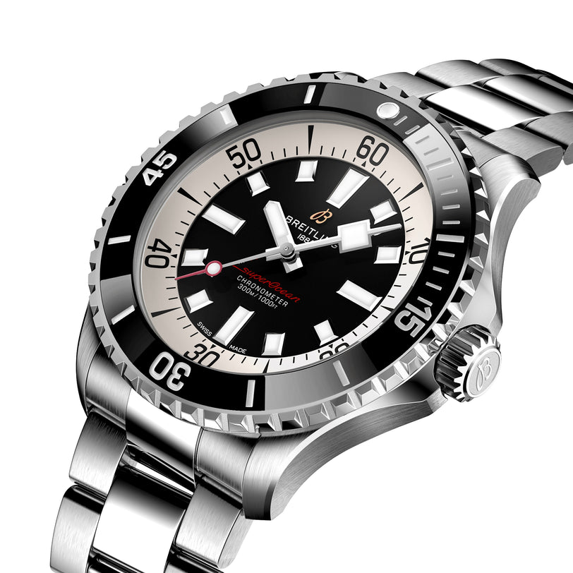 A stainless steel Breitling Superocean Automatic 46 dive watch with black bezel, black and white dial, red text, and metal bracelet, featuring the Breitling 17 calibre, is shown angled on a white background.