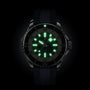 The Breitling Superocean Automatic 46 is a black wristwatch with a luminous dial and green-glowing hands set at 10:09, powered by a Breitling 17 calibre movement and designed for lasting water resistance.