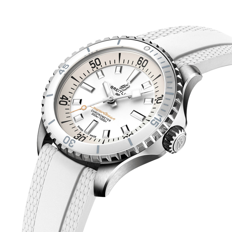 The Breitling Superocean Automatic 36 dive watch features a white face, ceramic bezel, Super-LumiNova markers, and a textured white strap, displayed at an angle on a white background.