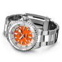 The Breitling Superocean Automatic 36 is a stainless steel dive watch with an orange dial, silver bezel, and metal bracelet band, shown on a white background and featuring reliable automatic movement.