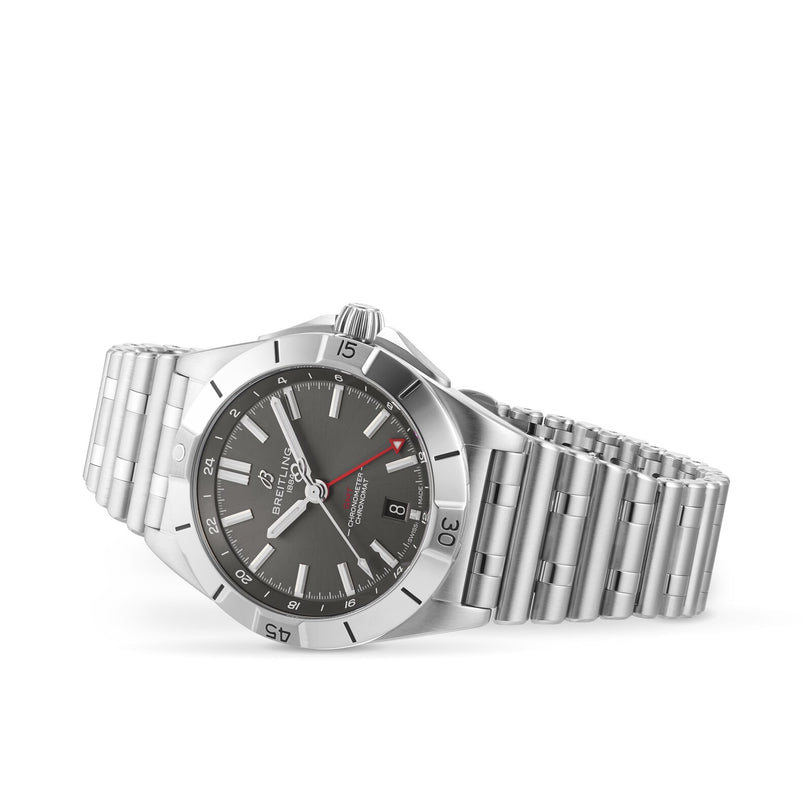 The Breitling Chronomat Automatic GMT 40, featuring a stainless steel case, metal bracelet, gray dial, and red-tipped second hand, is displayed on a white background.