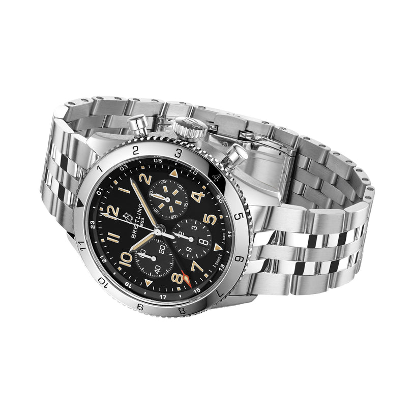 The Breitling Super AVI B04 Chronograph GMT 46 P-51 Mustang features a stainless steel case, black chronograph dial, luminous hands, and a metal bracelet—displayed at an angle and inspired by the iconic P-51 Mustang.