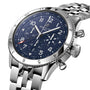 A close-up of the Breitling Super AVI B04 Chronograph GMT 46 Tribute To Vought F4U, a stainless steel pilots watch with a blue dial, chronograph subdials, metal link bracelet, and the renowned Breitling B04 Manufacture calibre.
