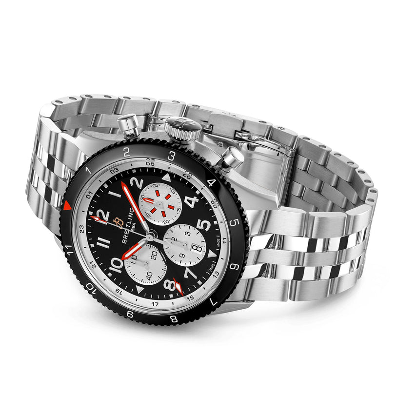 The Breitling Super AVI B04 Chronograph GMT 46 Mosquito is a stainless steel pilot’s watch with a black bezel, black dial, three white subdials, silver metal link band, and the renowned B04 Manufacture calibre.