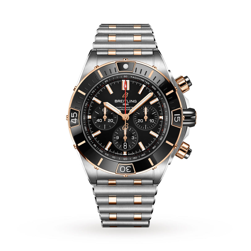 The Breitling Super Chronomat B01 44 is a luxury chronograph wristwatch with a silver and 18ct rose gold band, black bezel, and multiple subdials on a black face. COSC certified for precision, shown against a white background.