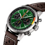 A close-up of the Breitling Top Time B01 Ford Mustang shows its racing green dial, brown perforated leather strap, stainless steel case, and precise Breitling Manufacture Calibre 01 movement.