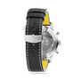 Back view of the Breitling Top Time B01 Deus, showcasing a black leather strap with white stitching, metal buckle, yellow lining, and a transparent case back that reveals the Manufacture Calibre 01 racing chronograph movement.