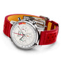 The Breitling Top Time B01 Ford Thunderbird is a stainless steel chronograph with a white dial, three subdials, red perforated leather strap, deployment clasp, and is powered by the Breitling Manufacture Calibre 01.