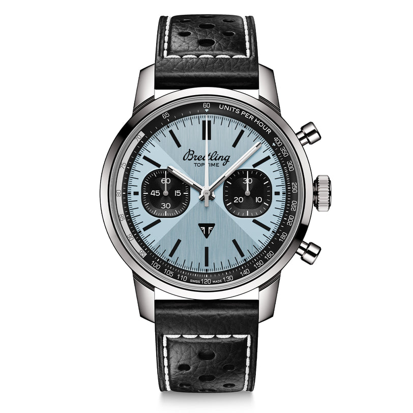 The Breitling Top Time B01 Triumph is a silver and black chronograph wristwatch with a light blue dial, black subdials, and a black leather strap with white stitching, powered by the Breitling 01 calibre.